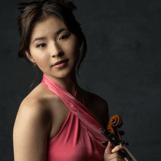 photo of Hina Khuong-Huu holding a violin